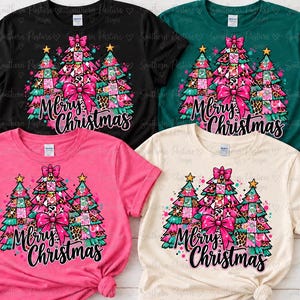 May include: Four short-sleeve t-shirts in black, dark green, bright pink, and cream. Each shirt features a graphic of three stylized Christmas trees with leopard and plaid patterns, topped with gold stars and a large pink bow, with Merry Christmas text.