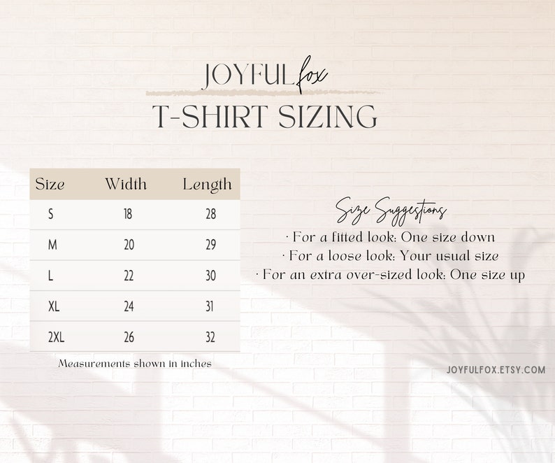 May include: T-shirt sizing chart with measurements in inches for sizes S, M, L, XL, and 2XL. The chart includes width and length measurements for each size. Size suggestions are provided for a fitted, loose, or extra over-sized look.
