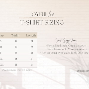 May include: T-shirt sizing chart with measurements in inches for sizes S, M, L, XL, and 2XL. The chart includes width and length measurements for each size. Size suggestions are provided for a fitted, loose, or extra over-sized look.