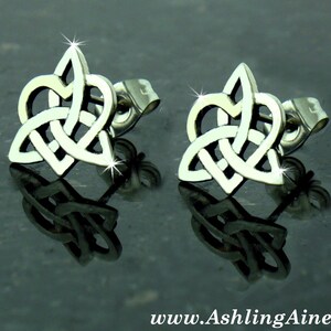 May include: A pair of silver Celtic knot heart stud earrings. The earrings are made of stainless steel and have a polished finish.