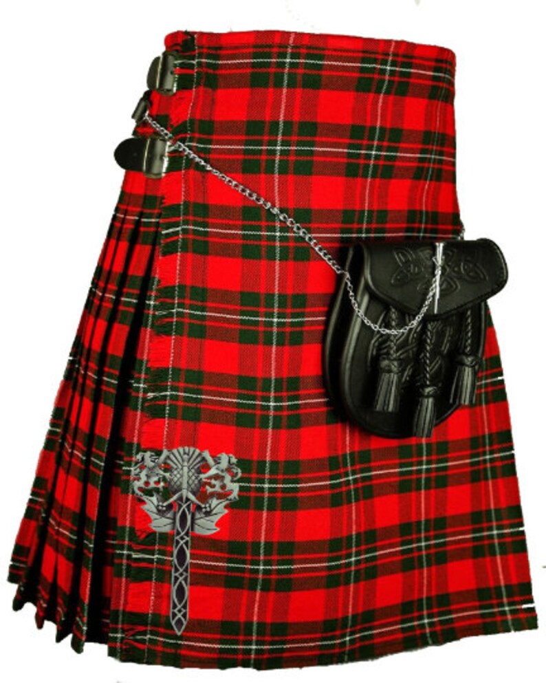 May include: A red, green, and white plaid kilt with a black leather sporran and a silver chain. The kilt has a silver kilt pin with a Celtic knot design.