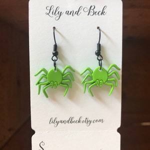 Green spider earrings