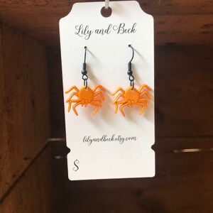 Orange spider earrings