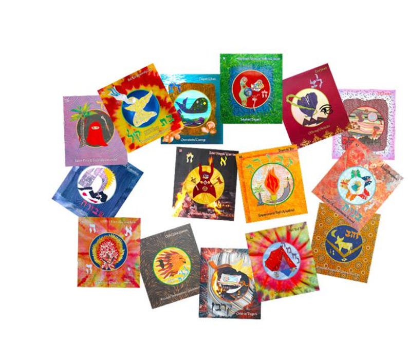 May include: A collection of colorful, square-shaped cards with various illustrations and Hebrew text. The designs include images of birds, whales, flames, and abstract patterns, set against backgrounds of tie-dye, solid colors, and geometric shapes. The cards are arranged in a circular pattern.