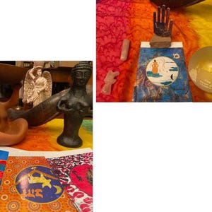 May include: A collection of spiritual and decorative items, including statues, a wooden hand sculpture, crystals, and a glass globe. The items are arranged on a colorful, patterned fabric, creating a vibrant and eclectic display.