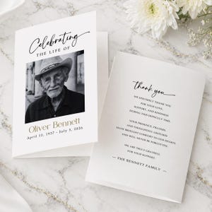 May include: A memorial card featuring a black and white photograph of a man in a hat. The card is inscribed with "Celebrating the Life of Oliver Bennett" and dates. The inside reads "thank you" and a message of gratitude.
