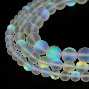 STRAND OF CLEAR WHITE OPAQUE IRIDESCENT GLASS BEADS