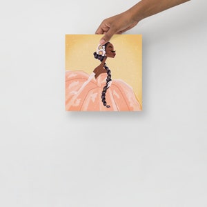 May include: A digital illustration of a Black woman wearing a peach-colored gown with a white flower crown. She has long, dark braids and is looking to the right. The background is a light yellow with a sparkle effect.