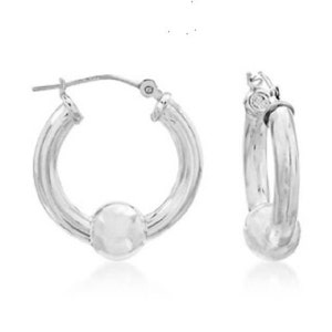 May include: A pair of silver hoop earrings with a smooth ball charm at the bottom of each hoop.
