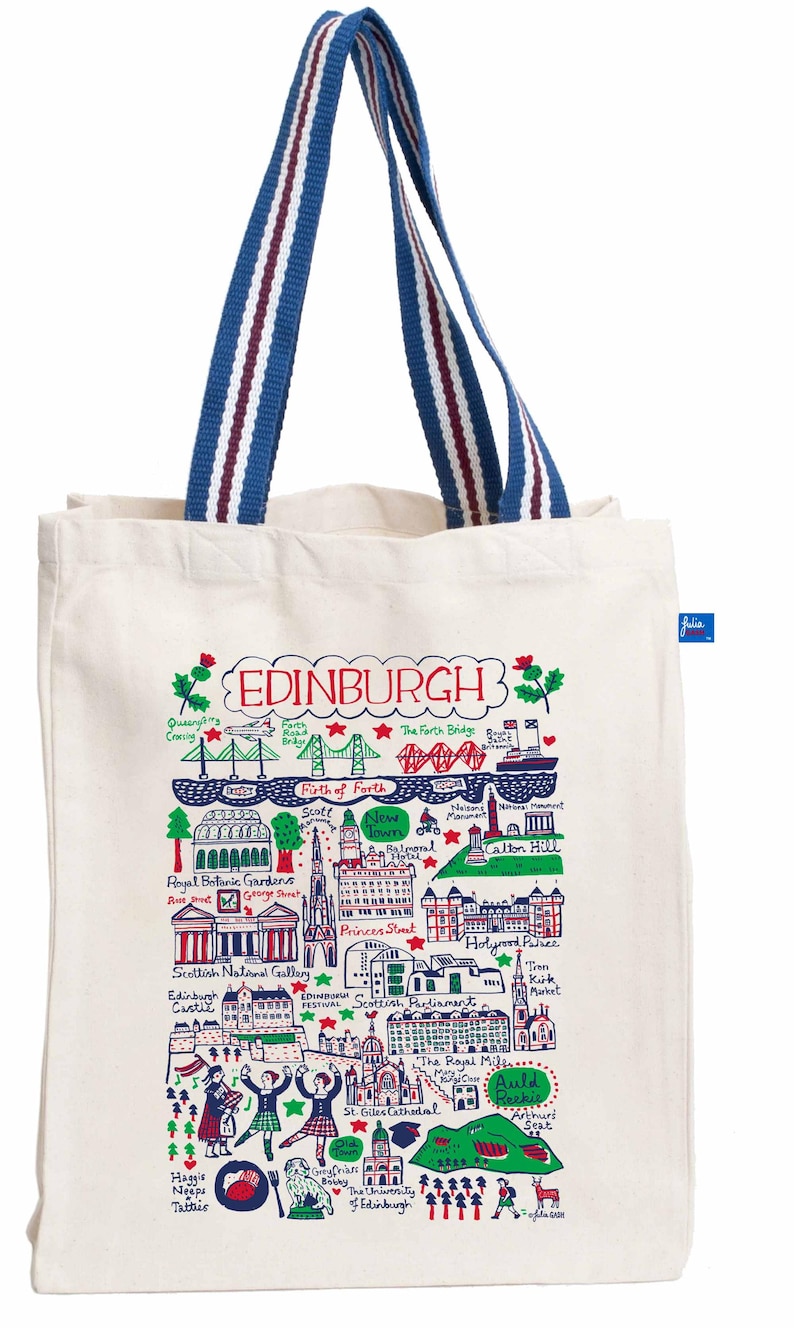 May include: Cream-colored tote bag featuring a colorful illustrated map of Edinburgh, Scotland. The map includes landmarks like the Forth Bridge and Edinburgh Castle. The bag has blue and white striped handles. The word "EDINBURGH" is at the top.