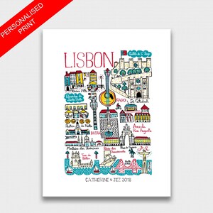 May include: A colorful illustrated map of Lisbon, Portugal, with landmarks and points of interest highlighted. The map includes the text "LISBON" in red lettering at the top and "CATHERINE & JEZ 2018" at the bottom.