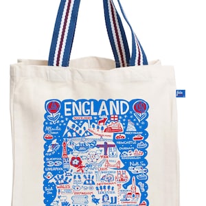 May include: Cream-colored tote bag with blue and red striped handles. The bag features a blue and red illustrated map of England, with city names and landmarks. The word "ENGLAND" is at the top.