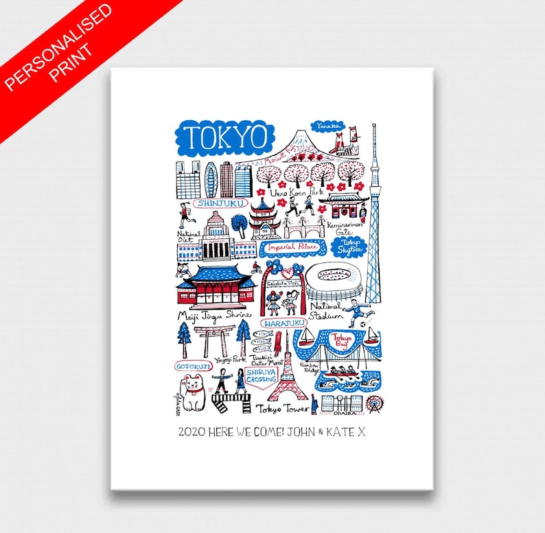 May include: A white art print featuring a hand-drawn illustration of Tokyo landmarks in blue, red, and black ink. The design includes Tokyo Tower, Skytree, and Meiji Jingu Shrine, with the text "TOKYO" at the top and "2020 HERE WE COME! JOHN & KATE X" at the bottom.