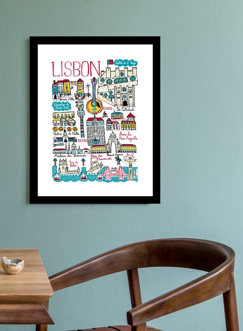 May include: A colorful illustrated map of Lisbon, Portugal, with landmarks and points of interest highlighted. The map features a blue and white tiled pattern, red and yellow buildings, and a guitar symbol.