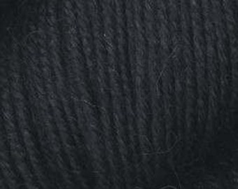 May include: Close-up of a skein of black yarn. The yarn appears soft and textured, with visible strands and a slightly fuzzy appearance. The dark color suggests it could be used for various knitting or crocheting projects.