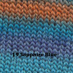 May include: Close-up of a knitted fabric in shades of blue, orange, and brown. The fabric has a chevron pattern. The text "19 Sapphire Blue" is visible in the lower centre of the image.
