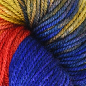 May include: Close-up of a skein of yarn with a gradient of blue, red, yellow, and orange colors. The yarn is twisted and textured.