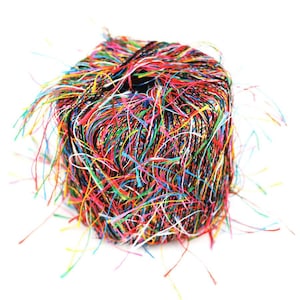 May include: A ball of colorful yarn with long, loose strands. The yarn is a mix of black, white, red, yellow, blue, green, and pink.