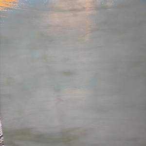 May include: A large, rectangular piece of pale green and white stained glass. The glass has a cloudy, textured appearance with subtle variations in color. The edges are slightly uneven, suggesting it is hand-cut. The glass is likely for crafting or decorative purposes.