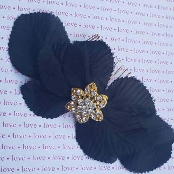 Black Silk Flower Leaves create a bow shaped headpiece~comb. Sparkly, Gold Flower with Rhinestones  in Center.