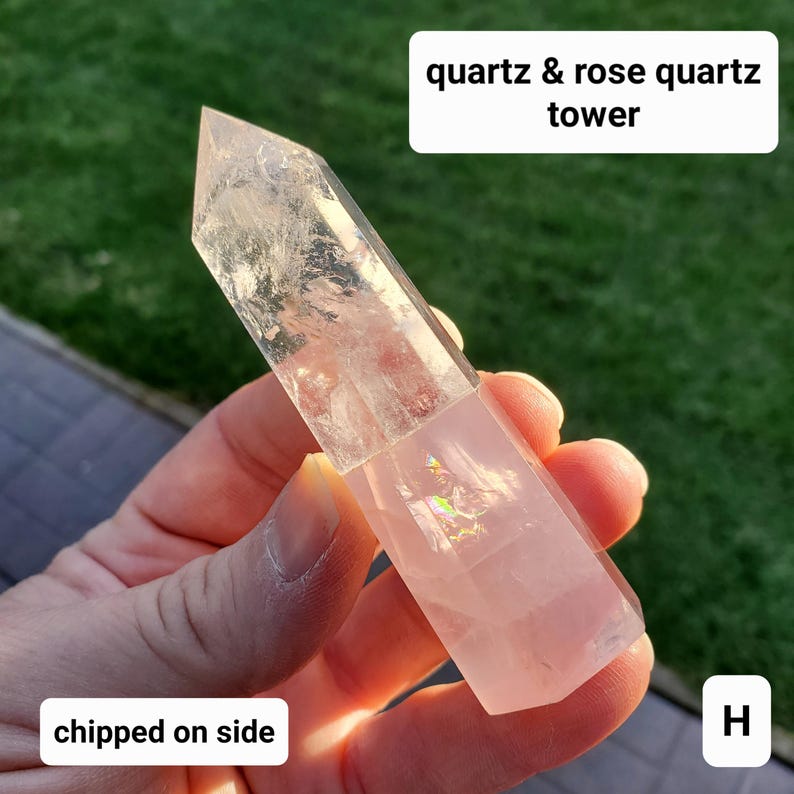 May include: A quartz and rose quartz tower with a pointed top. The top portion is clear quartz, while the bottom is a soft pink rose quartz. Text on the image reads "quartz & rose quartz tower" and "chipped on side."