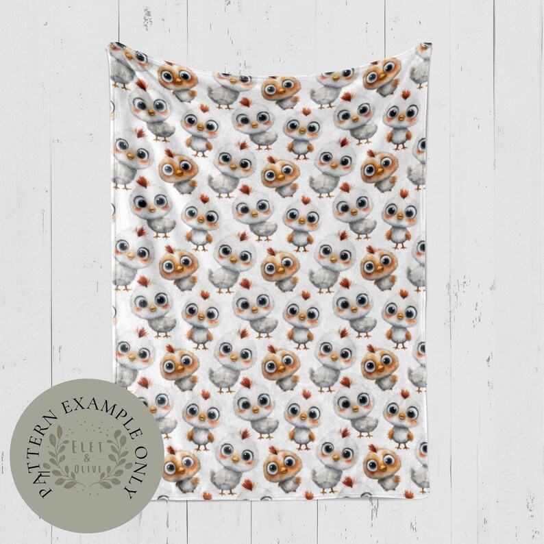 May include: A white blanket with a repeating pattern of cartoon chicks in various shades of white and brown. The chicks have large eyes and red crests. The blanket is displayed against a white wooden background. A circular logo in the bottom left corner reads "Pattern Example Only".