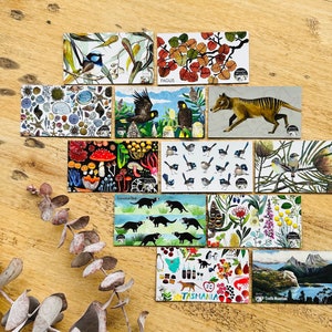 May include: A set of 10 illustrated postcards featuring various flora and fauna native to Tasmania, Australia. The cards feature images of Tasmanian devils, mushrooms, birds, and flowers. The cards are printed on high-quality cardstock and are perfect for sending a unique and personal message.