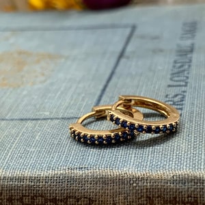 sapphire huggie earrings, blue hoop earrings, gold hoop earrings, gift, gift for her, earrings under 30, sapphire jewelry, gold huggie