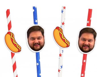 May include: Three red, white, and blue striped paper straws with a hot dog and a face cutout on each. The hot dog is yellow with mustard and relish. The face cutout is of a person with a beard and brown hair.
