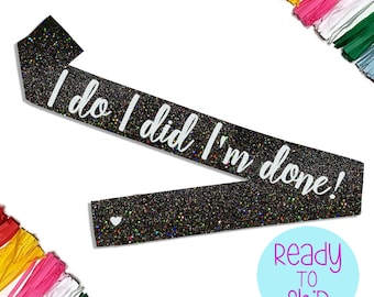 May include: Black glitter sash with white text that reads "I do I did I'm done!"
