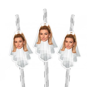 May include: Three paper straws with a white and silver striped design. Each straw has a white die-cut image of a woman's face wearing a veil and a bow. The woman has blonde hair and is wearing earrings.
