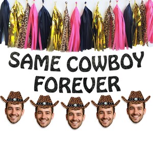 May include: A banner with the text "SAME COWBOY FOREVER" in black glitter letters. Below are five face cutouts wearing cowboy hats with leopard print crowns. Above are hanging tassels in gold, pink, black, and leopard print.