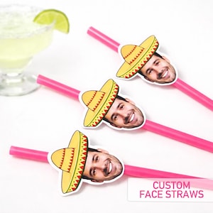 May include: Pink plastic straws with custom face cutouts wearing yellow and red sombrero hats. The straws have a white background and the text "CUSTOM FACE STRAWS". A margarita cocktail is in the background.