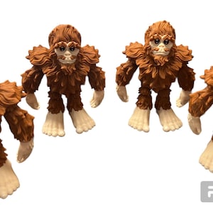 May include: Four brown furry Bigfoot figures with white faces and hands. The figures are standing on a white background.