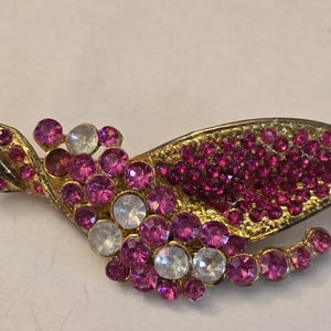 Vintage pink and gold brooch pin.