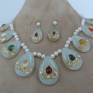 Jadau Inlay Navratna Necklace set on white chalcedony stone in 24 karat gold and pearl necklace (9 planetary cosmic gemstones necklace)
