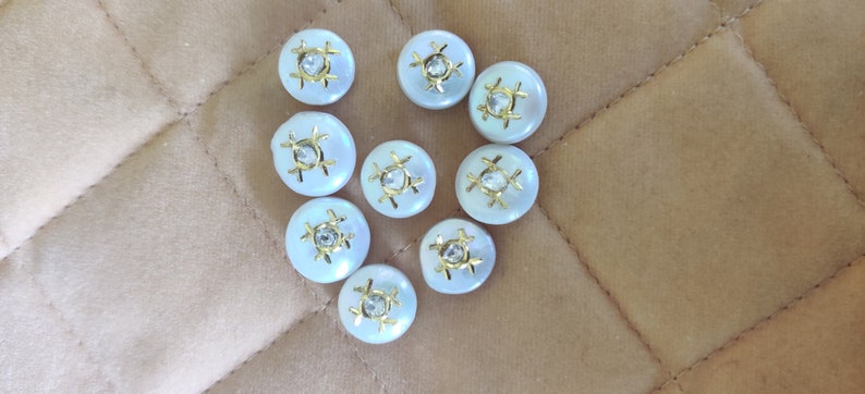 inlaid Pearl encrusted with diamond polki and gold.