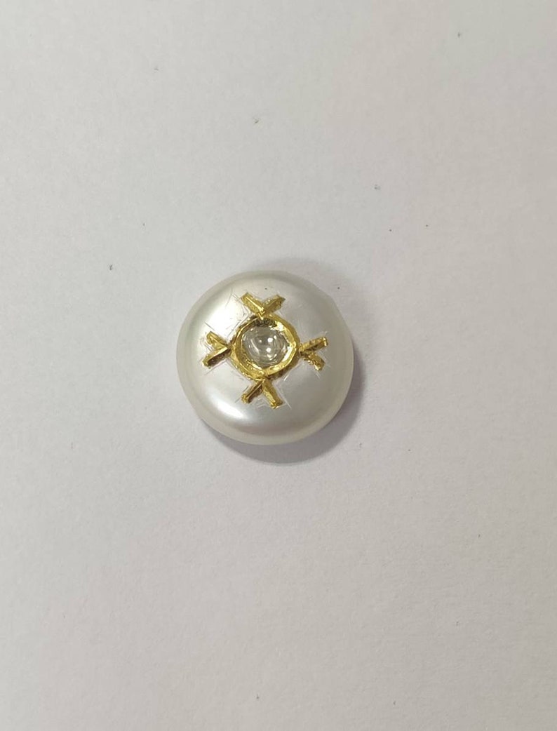 inlaid Pearl encrusted with diamond polki and gold.