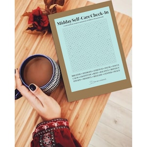 May include: A rectangular card titled Midday Self-Care Check-In with a word search puzzle and a list of words including BREATHE, HYDRATE, STRETCH, PAUSE, FOCUS, CALM, GRATITUDE, REST, BALANCE, REFLECT, STEADY, MINDFUL, RELEASE, CENTER, and PEACE.