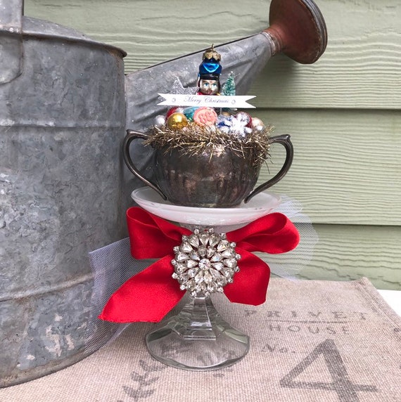 Shabby Chic Cottage Style Holiday Christmas Centerpiece Decoration with Tin Soldier , Vintage Silver Cup, Saucer, Vintage Rhinestone Pin