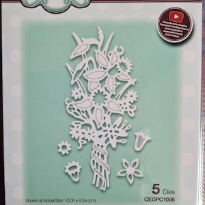 May include: A packet of craft dies for paper cutting, featuring a white floral bouquet design. The packet includes five dies and the text "Creative Expressions" and "Craft Dies". The actual size is 10.0h x 4.5w (cm).