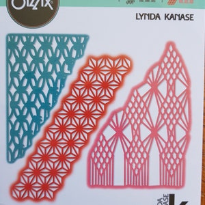 May include: A pack of three Sizzix Thinlits dies for crafting. The dies feature geometric patterns in teal, red and pink. The pack includes the text "THINLITS", "LYNDA KANASE", and "663589".