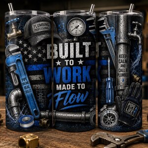 May include: A cylindrical tumbler featuring a dark blue and black design with a plumbing theme. It displays a pressure gauge, a pipe wrench, a cap labeled PLUMBING PROFESSIONAL, and text reading BUILT TO WORK MADE TO FLOW and KEEP CALM AND CALL A PLUMBER.