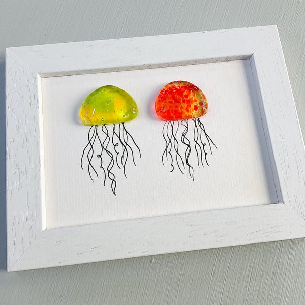 Glass jellyfish wall art - framed fused glass pebble picture handmade in Cornwall by Niko Brown