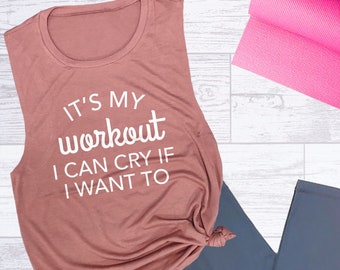 May include: A mauve tank top with the text "It's my workout I can cry if I want to" printed in white.