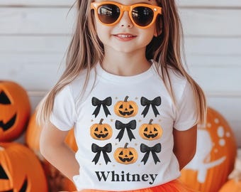 Personalized Jack-o-Lantern Bows T-Shirt: Coquette Halloween Graphic Tee for Girls