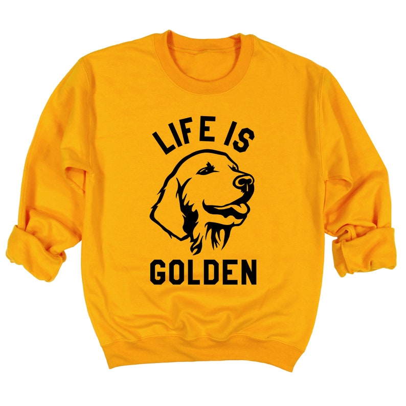 May include: A yellow sweatshirt with black text that reads "Life is Golden" and a black silhouette of a golden retriever dog's head.