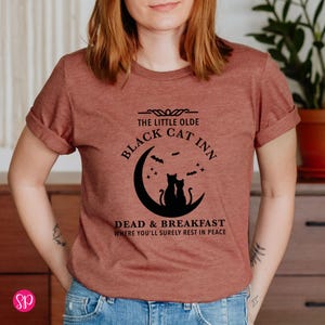 Black Cat Inn Halloween T-Shirt: Funny Fall Graphic Tee