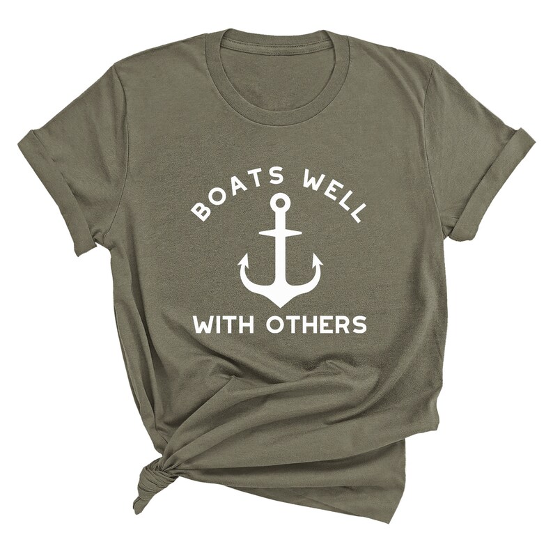 May include: A green t-shirt with a white anchor and the text "BOATS WELL WITH OTHERS".