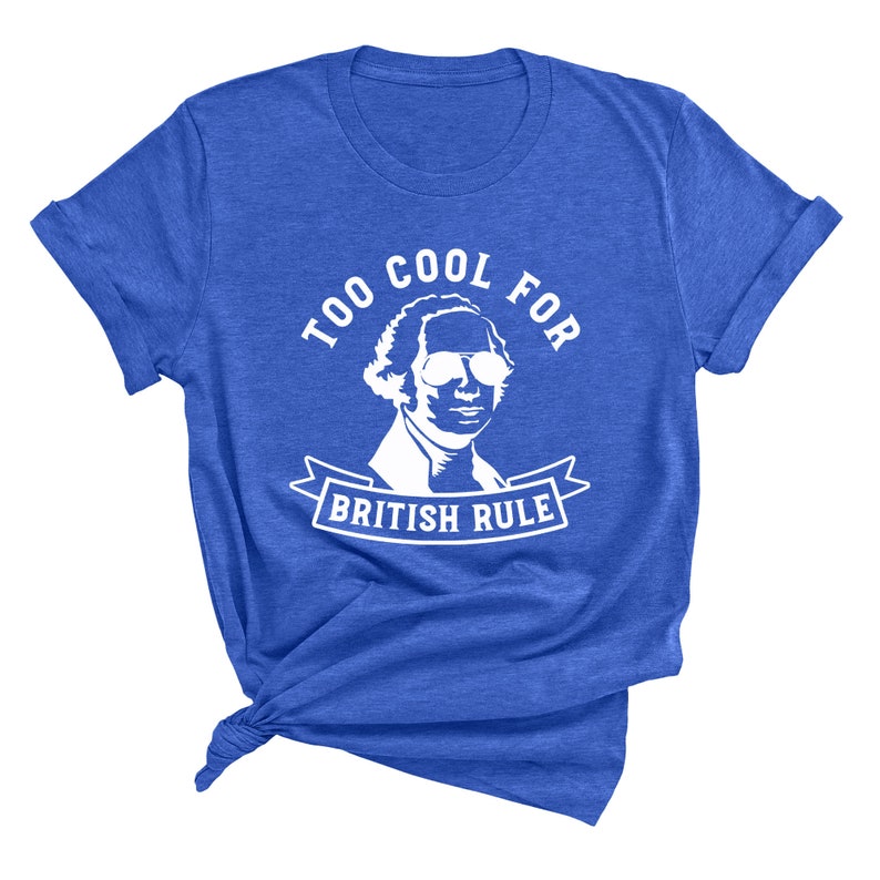 May include: A royal blue t-shirt with a white graphic of George Washington wearing sunglasses and a banner that reads "Too Cool For British Rule".